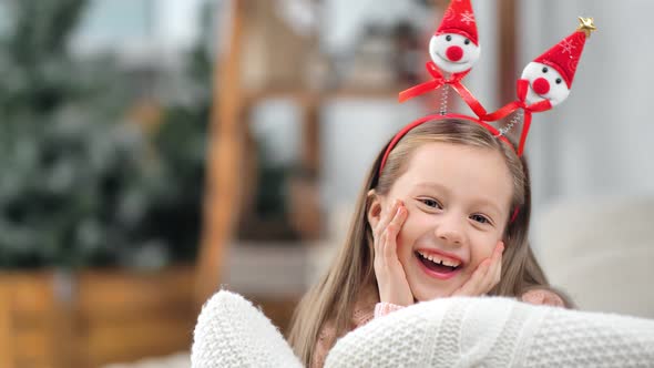 Portrait of Little Baby Girl Posing in Funny Christmas Ears Laughing Having Positive Emotion