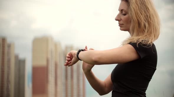 Woman Checking Pulse On Smartwatch.Runner Girl Running Wristband.Runner Use Smart Watch.