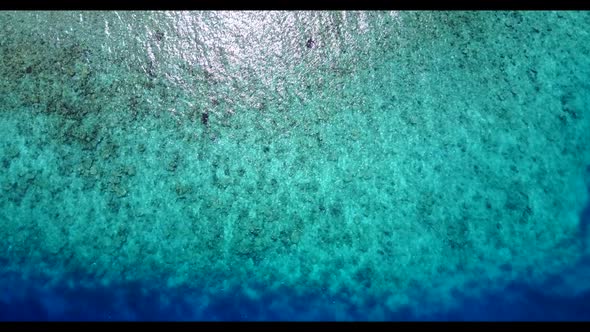 Aerial drone shot abstract of exotic shore beach vacation by turquoise water and white sand backgrou