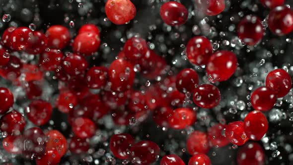 Super Slow Motion Shot of Cranberries and Water Explosion Towards Camera at 1000Fps