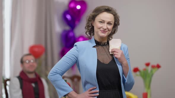 Middle Shot Portrait of Beautiful Proud Adult Caucasian Woman Posing Indoors with Decorated