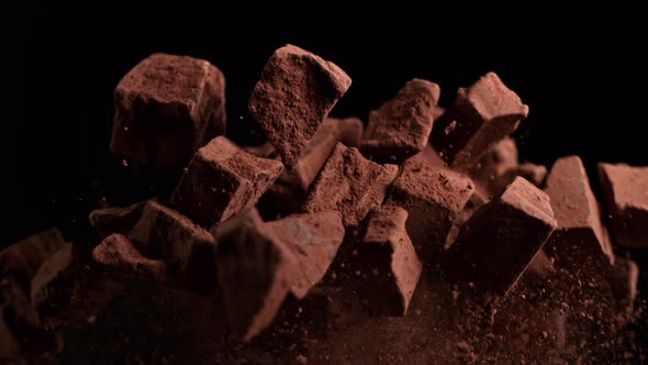 Super Slow Motion Shot of Raw Chocolate Chunks After Being Exploded at 1000Fps