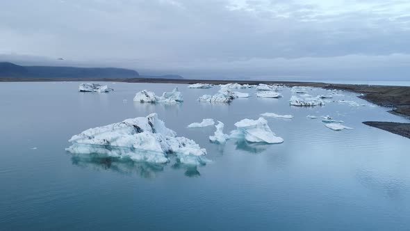 Melting Ice Pieces Floating On Lagoon Water