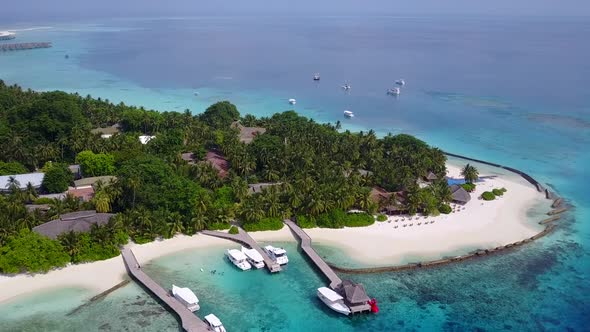 Aerial panorama of resort beach trip by clear ocean with sand background