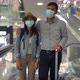 Couple Asian people walking in airport terminal waiting for  flight boarding. - VideoHive Item for Sale