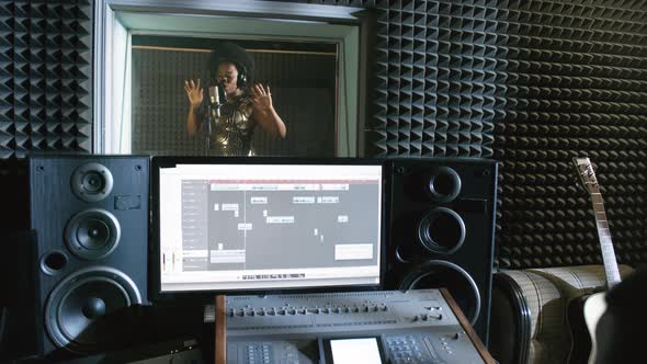 Singer Recording Song in Studio