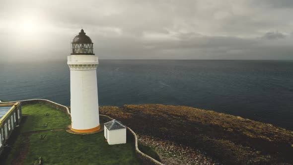 White Lighthouse at Sun Sea Bay Closeup Aerial