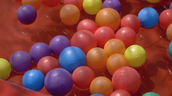 colourful plastic balls in blow up pool