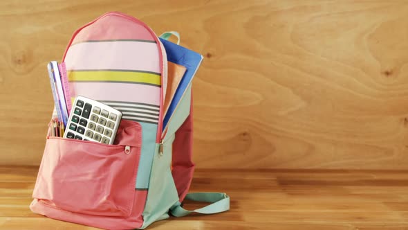 Close-up of school bag with books and stationery