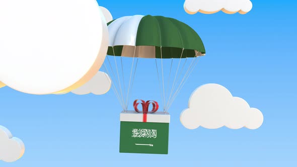 Box with Flag of Saudi Arabia Falls with a Parachute