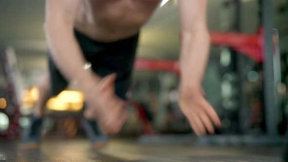 Determined Male Training at the Gym Doing Clap Push Ups