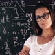 Beautiful Brunette Woman Posing Over School Board With Math Formulas. - VideoHive Item for Sale