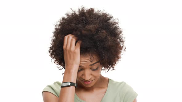 Young Beautiful African Girl Feeling Shame Over White Background