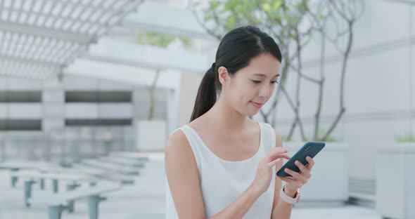 Woman use smart phone at outdoor