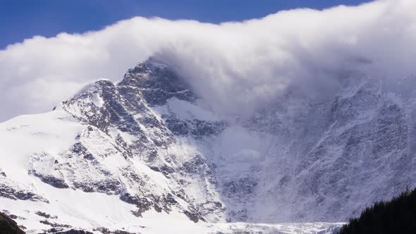 Timelapse of dissolving foehn clouds at Fiescherwand in Switzerland