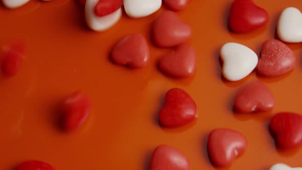 Rotating stock footage shot of Valentines decorations and candies - VALENTINES 0050