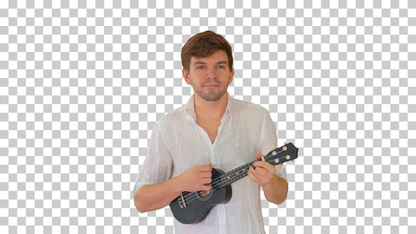 Young man playing ukulele while walking, Alpha Channel