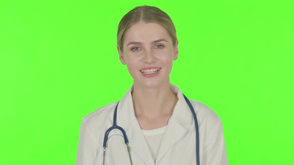 Female Doctor Talking on Online Video Call on Green Background