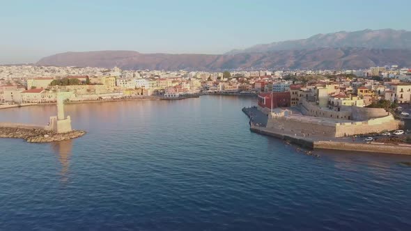 Aerial drone view video of iconic and picturesque Venetian old port of Chania with famous lighthouse