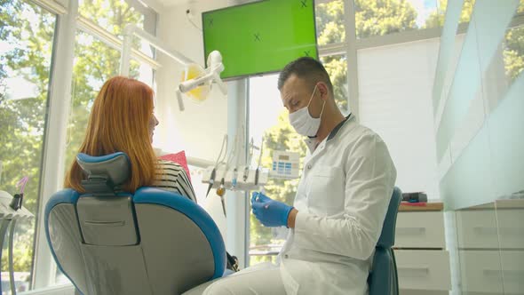 Close Up Teeth Polishing Procedure. Dentist Hands Working with Dental High Speed Drill. Modern