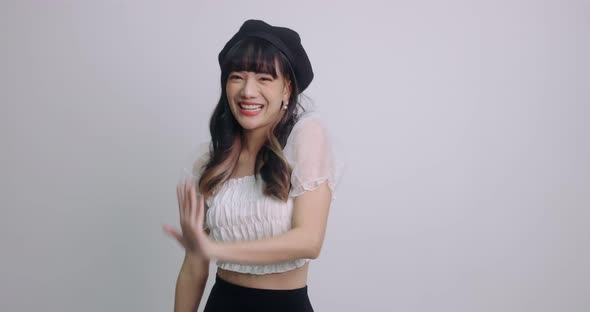 Young Lovely Asian Girl Having Fun Smiling And Dancing In Studio. People Lifestyle Concept.