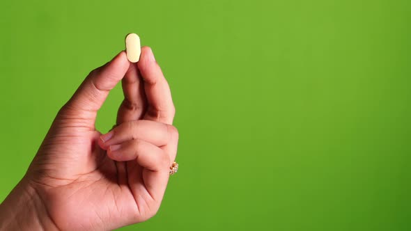 Hand Holding Pills with Copy Space 