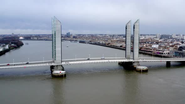 Jacques Chaban-Delmas Bridge in Bordeaux France with  car traffic over Garonne river, Aerial lowerin