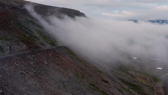 Aerial View Of The Thick Fog Covering The Mountain Pass In Westfjords, Iceland.