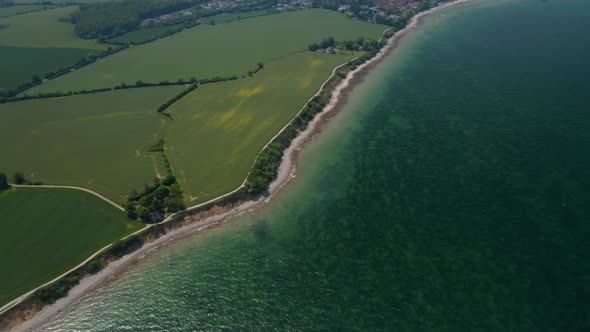 Baltic Sea Coastline in Brodten Germany High Aerial Drone View of Vast Background German Countryside