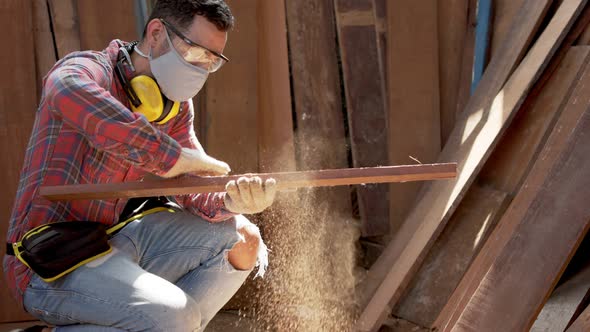 Carpenter marks out the details of the furniture .