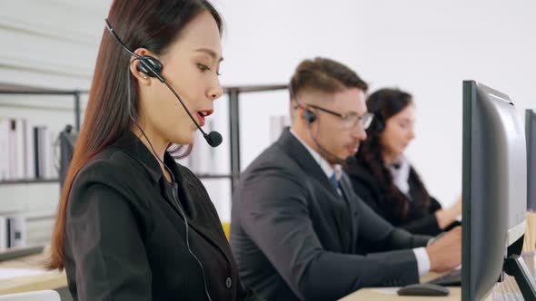 Business People Wearing Headset Working in Office