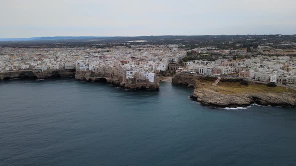 Super wide aerial drone shot of Polignano A Mare, Italy from Adriatic sea.