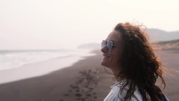 Closeup Beautiful Girl Enjoying the Wet Wind on the Beach