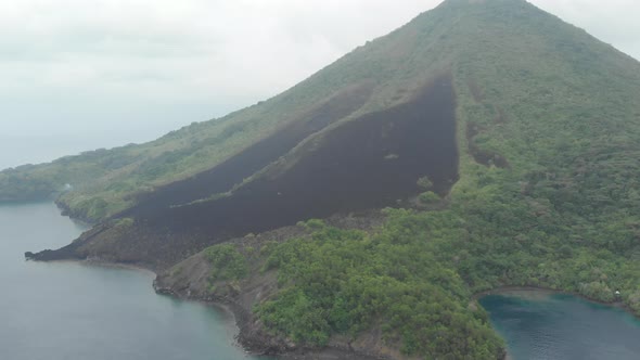 Aerial: flying over Banda Islands active volcano Gunung Api lava flows Maluku In