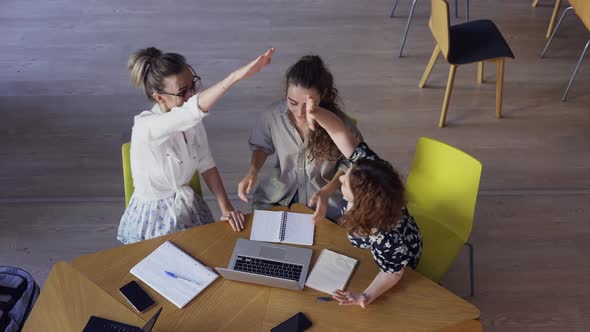 Female Students Discussing Great Ideas in Library High Angle View