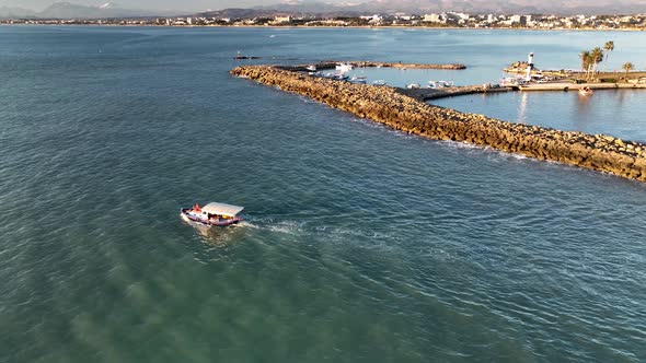 Yacht sails out of port Aerial View 4 K