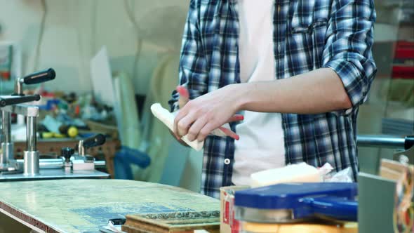 Worker Injured Hand Laying a Bandage on the Wound