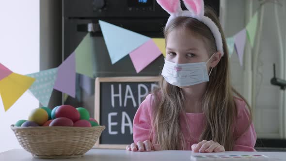 Funny Child Rabbit in Mask and Ears Play Easter Hare Hunter at Home