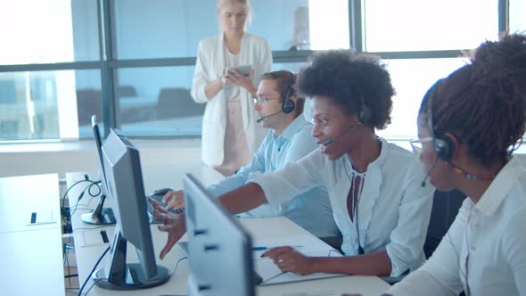 New Call Center Operators Headsets Working Computers