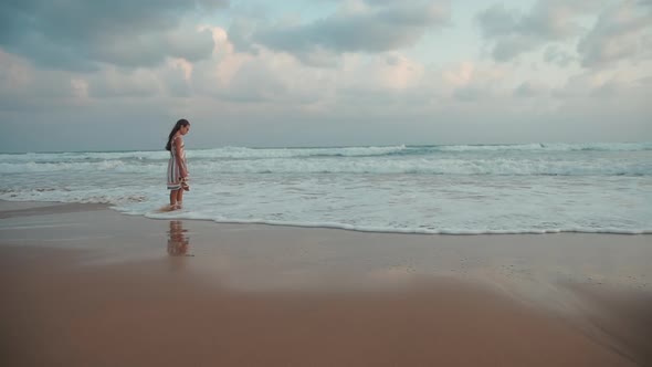 Carefree Girl Meditating at Seaside