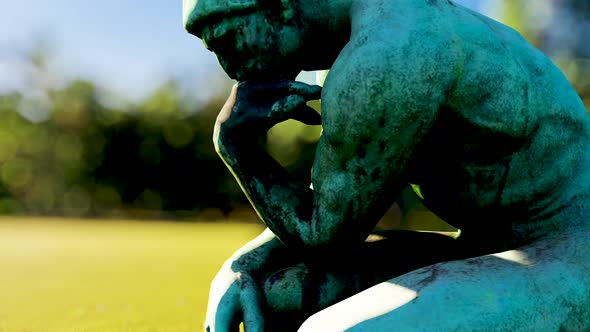 Thinker sculpture and books