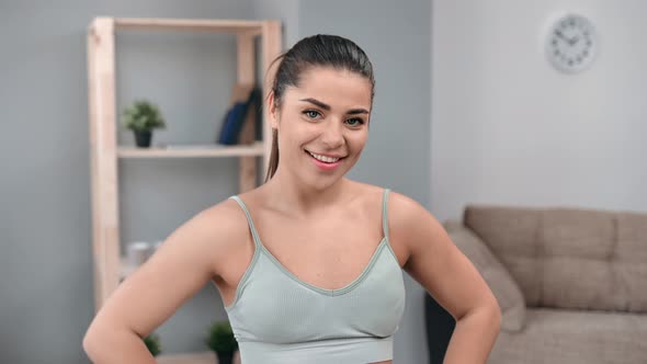 Portrait of Happy Young Brunette Fitness Woman Smiling Having Positive Emotion Posing at Home