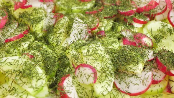 Close Up Salad of Radishes Cucumbers Cabbage Sprinkled with Dill