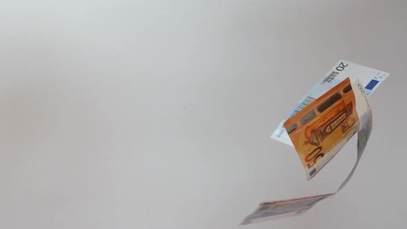 Rain of Euro Banknotes. Euro Banknotes Are Falling in Slow Motion Against White Background.