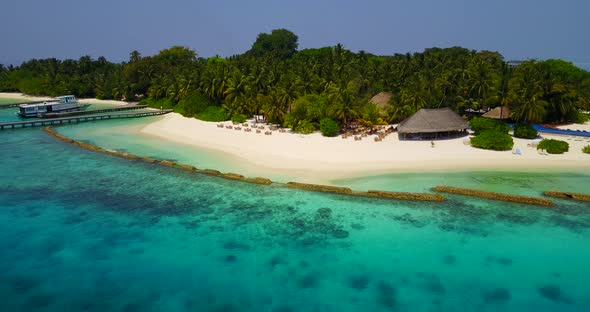 Beautiful birds eye copy space shot of a white sandy paradise beach and blue water background in vib