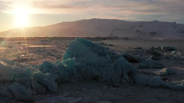 Close up shot of small icebergs lying on Jökulsárlón Glacier during beautiful sunrise in the morning