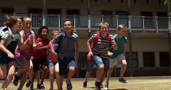 Group of kids running in the school