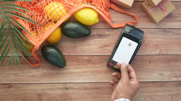 Contactless Payment Concept with Young Man Paying with Credit Card