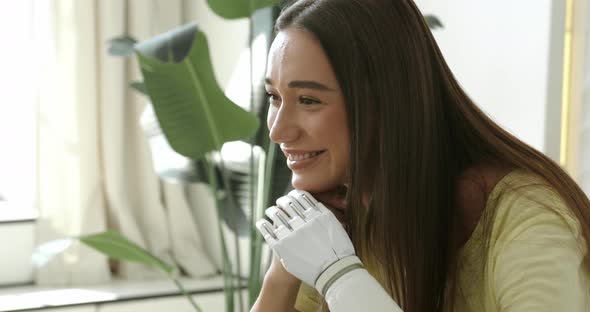 Portrait Happy Woman with Prosthetic Arm Relaxing at Home Girl with Disability Artificial Prosthetic