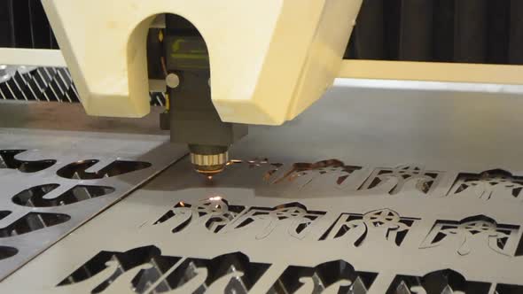A Laser Beam Cuts the Sheet Metal in the Manufacture